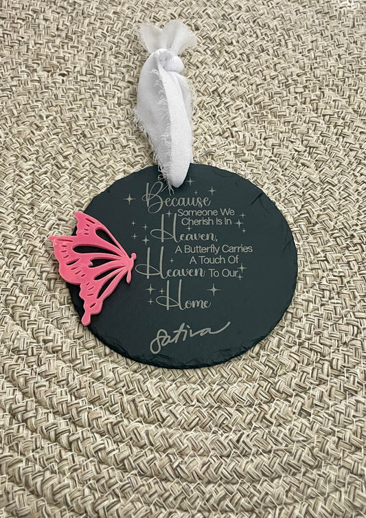 Decorative round slate ornament with pink butterfly and text
